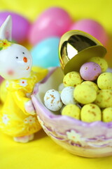 Easter Bunny with golden egg and Easter eggs