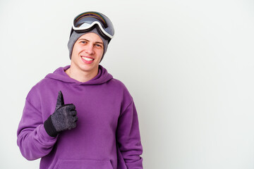 Young man holding a snowboard board isolated on white background smiling and raising thumb up
