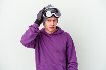 Young man holding a snowboard board isolated on white background being shocked, she has remembered important meeting.
