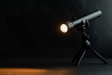 a powerful photo lamp on a folding tripod with hinged fasteners. accessories for photo and video...