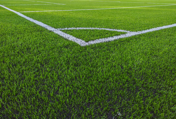 Artificial grass soccer field. Corner kick line of ball and a soccer field , football field , background texture