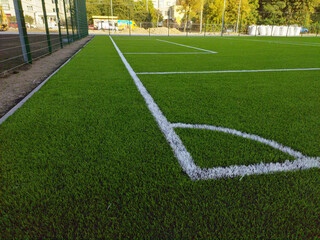 Artificial grass soccer field. Corner kick line of ball and a soccer field , football field , background texture