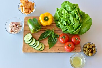 Healthy vegetables and chicken for preparing homemade meals with the Mediterranean diet. Fresh food background, photo concept, flat lay, copy space, whole foods