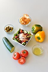 Healthy mediterranean ingredients with vegetables and chicken to make fresh nutritious salads and meals. Photo concept, background, table top view, copy space, healthy lifestyle