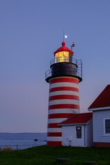 Evening Light and moonrise at the Lubec Lighthouse on the Northern coast of Maine