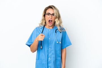 Brazilian surgeon doctor woman over isolated background surprised and pointing front