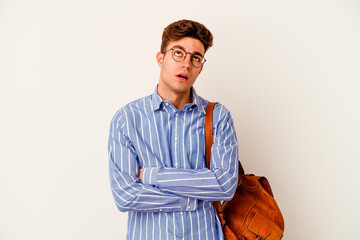 Young student man isolated on white background tired of a repetitive task.