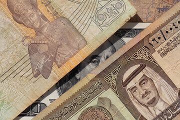 100 US dollar  and  old one riyal of Saudi Arabia, 50 piastres of Egypt
