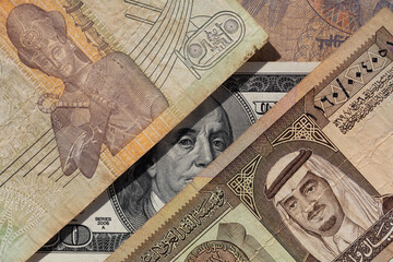 100 US dollar  and  old one riyal of Saudi Arabia, 50 piastres of Egypt