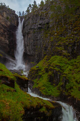 Obraz premium Nauståfossen is a beautiful waterfall in Todalen Norway. The waterfall has a drop of 110 meters. the area is known for its clean and distinctive environment