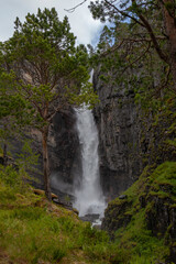 Fototapeta na wymiar Nauståfossen is a beautiful waterfall in Todalen Norway. The waterfall has a drop of 110 meters. the area is known for its clean and distinctive environment