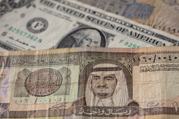  old one riyal of Saudi Arabia and 1 US dollar banknotes