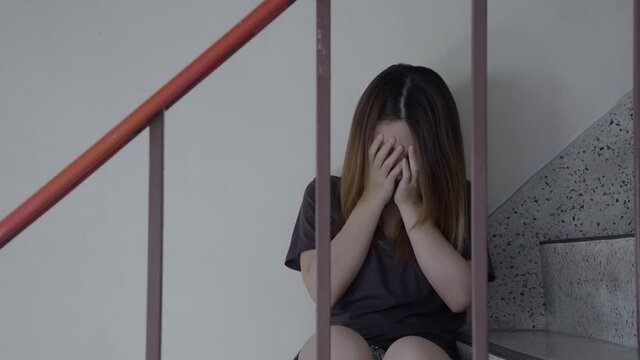 Depressed Asian woman concept of Mental health, imprisonment Human trafficking and broken married