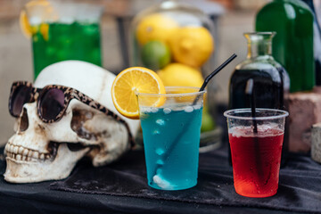 Multicolored alcoholic and non-alcoholic cocktails with straws