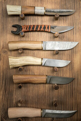 Various handmade knives with ornamental steel