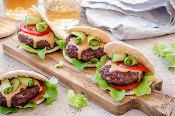 Pita burgers with fresh vegetables
