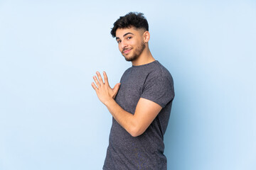 Arabian handsome man over isolated background scheming something