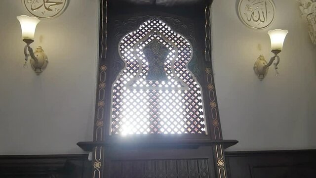 Glare the Sun in the Window of the Mosque
