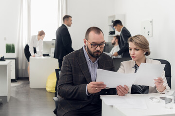 Communication for making a deal with a client of a financial company in the office at the table. Sales Manager and buyer