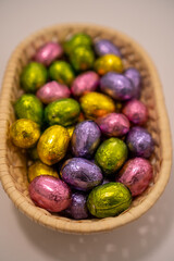 multicoloured chocolate easter candies in a basket