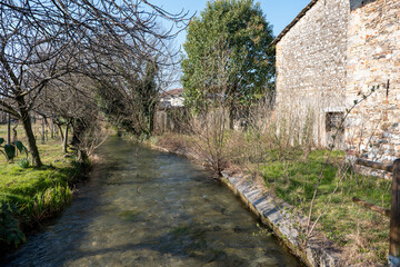 small river near the old stone house