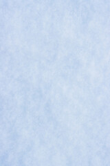 Natural snow texture. Smooth surface of clean fresh snow. Snowy ground. Winter background with snow patterns. Perfect for Christmas and New Year design. Closeup top view. Soft blurred background.