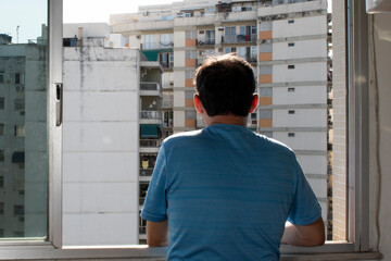 Fototapeta premium man series at the window during pandemic