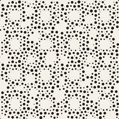 Vector seamless pattern with dotted circles. Stylish background with randomly disposed spots. Monochrome minimalist graphic design. Tileable simple texture from small black dots