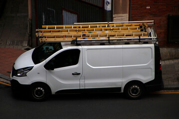 Van with a ladder in the roof rack
