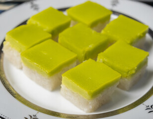 Malaysian dessert steamed glutinous rice with pandan layered custard or locally known as Kuih Seri Muka.