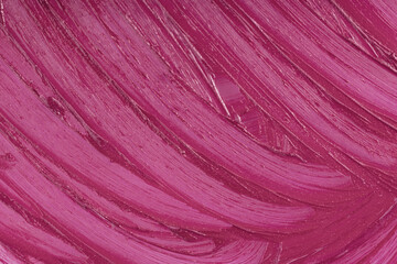 Marsala beauty product sample closeup. Purple cosmetics smear pattern background. Liquid lipstick...