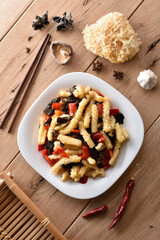 Original chinese dish - sweet sour calamari with paprika and mushrooms.
