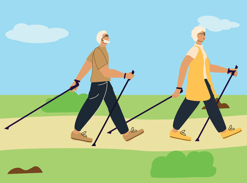 An elderly couple is engaged in Scandinavian walking in nature, in the park.
