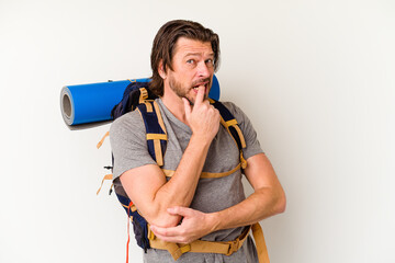 Middle age hiker dutch man isolated on white background relaxed thinking about something looking at a copy space.