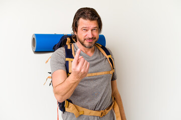 Middle age hiker dutch man isolated on white background pointing with finger at you as if inviting come closer.