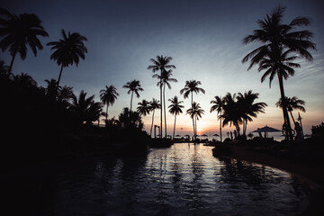 Fototapeta na wymiar Silhouette of asian tropical beach during an surrealistic sunset.