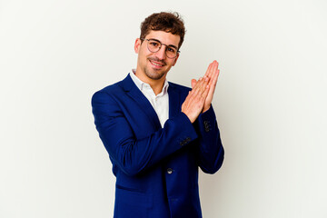 Young business caucasian man isolated on white background feeling energetic and comfortable, rubbing hands confident.
