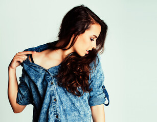 young pretty teenage hipster girl posing emotional happy smiling on white background, lifestyle...