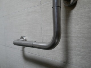 handicap handle for security in public toilet.