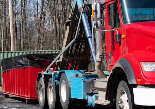truck picking up the container garbage auto dump