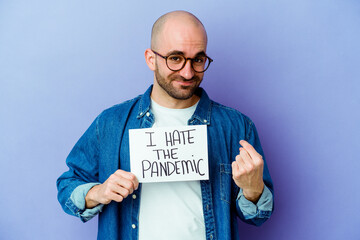 Young caucasian bald man holding a I hate the pandemic placard isolated on blue background pointing with finger at you as if inviting come closer.