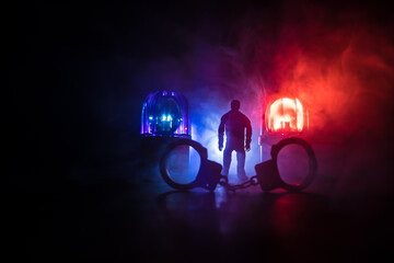 Legal law or crime concept. Man alone standing in the middle of the road on a foggy night. Artwork...