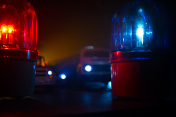 Police car blue and red round vintage siren in dark. Rotating retro style police siren in dark.