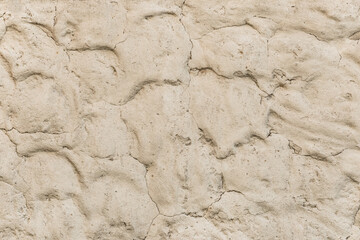 Light beige clay wall with abstract pattern sand texture background