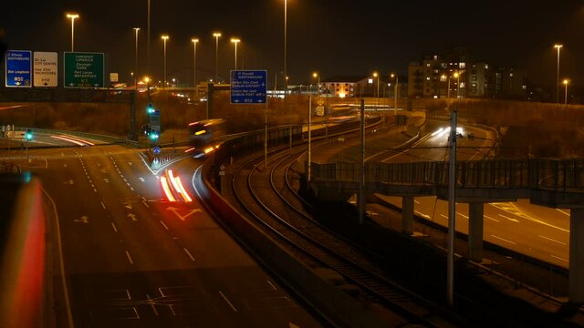 Night View Of Traffic With Light Trails On The Road In Red Cow Area, Dublin, Ireland. high angle shot, timelapse