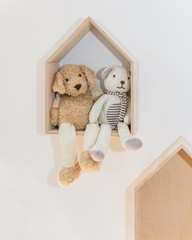 two teddy bears in a house-shaped box