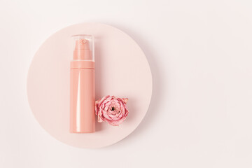 Aroma beauty spray with essential oil flower of rose on round podium. Cosmetic product top view