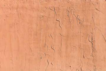 Light brown plaster wall with abstract stucco pattern texture background