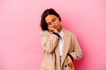 Young business mixed race woman isolated on pink background who is bored, fatigued and need a relax day.