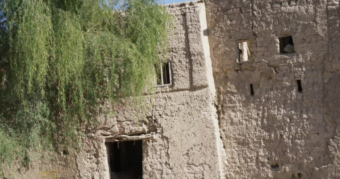 Bahla Fort ruins, UNESCO World Heritage Site, Bahla, Oman, medium shot tilt up